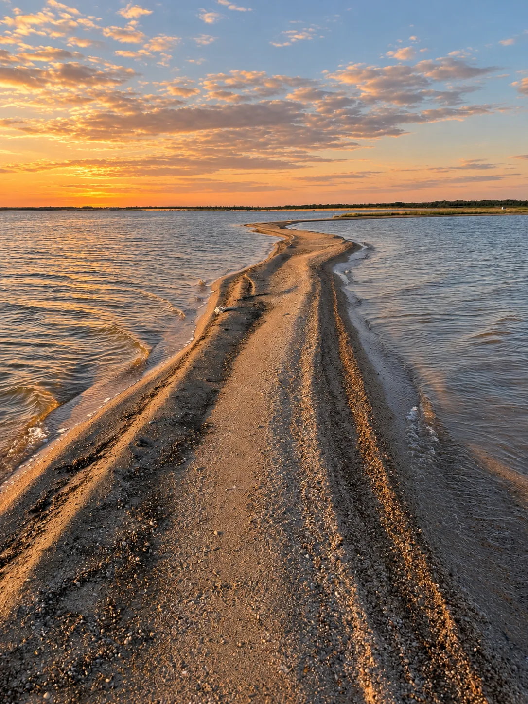 A narrow sand spit running out into the lagoon